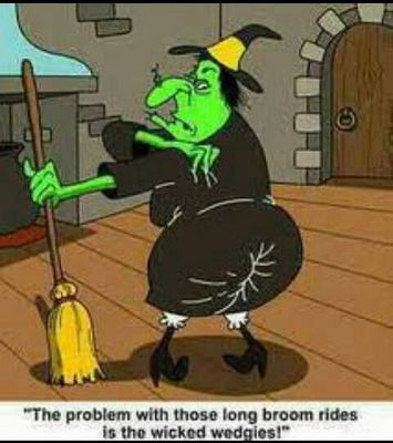 Halloween witch with green face and broom.jpg