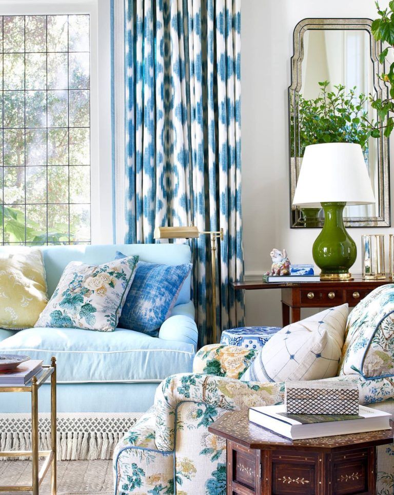 montecito-vacation-home-living-room-blue-ikat-curtains-sofa-tassel-trim-floral-lee-jofa-chintz-pillow-armchair-green-table-lamp.jpg
