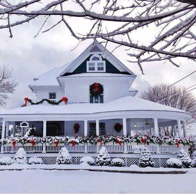 Snowy-house-with-Christmas-garland-decor-outside.jpg