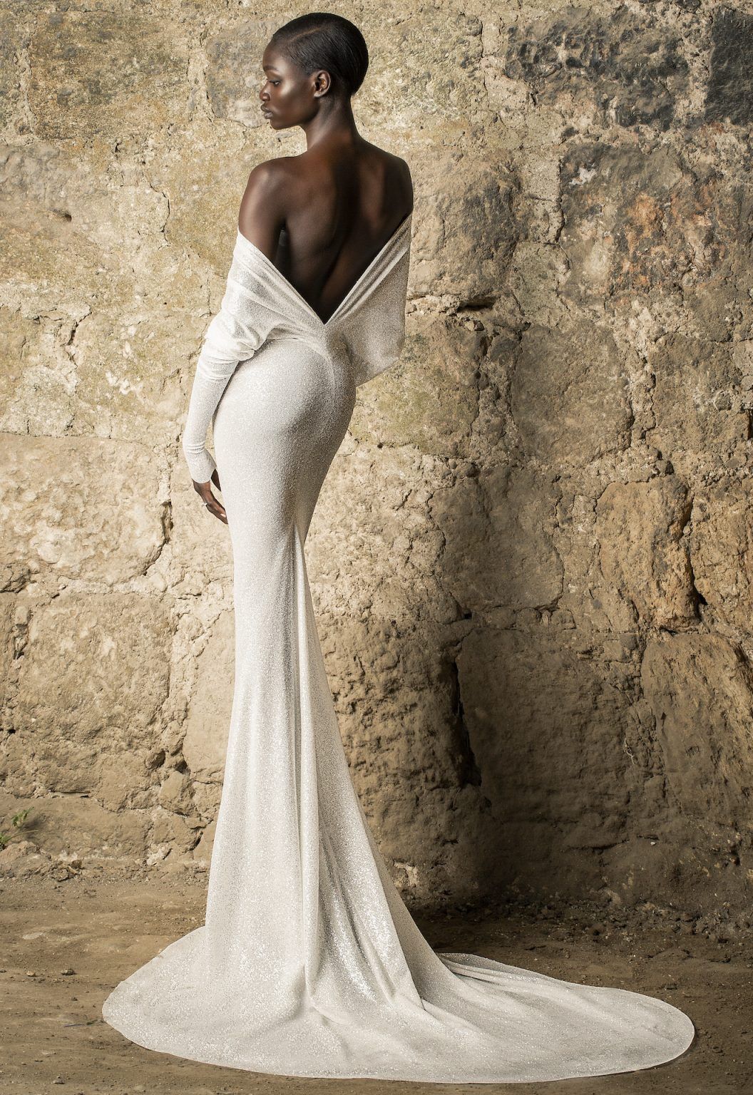 pnina-tornai-off-the-shoulder-long-sleeve-draped-glitter-sheath-wedding-dress-with-low-back-48000008-1-1056x1536.jpg