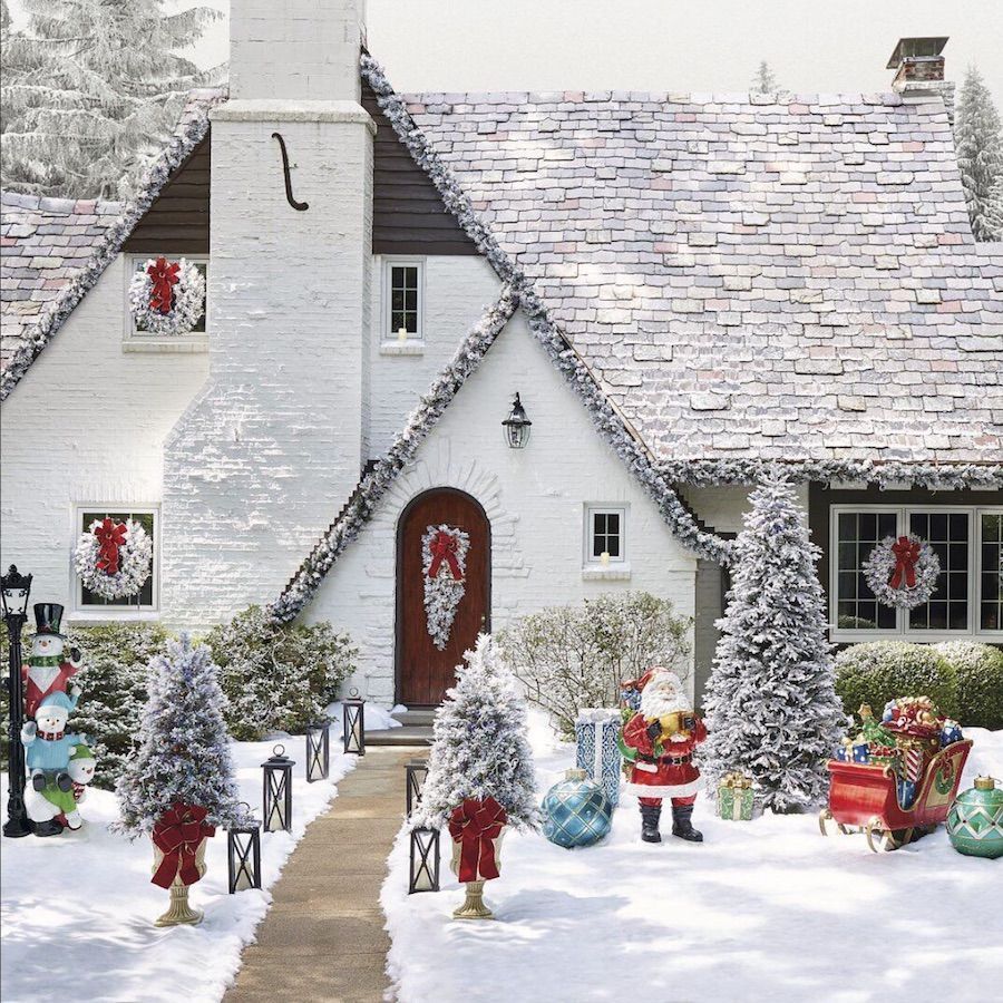 Christmas-front-yard-decor-with-frosted-garlands-on-the-house-via-@frontgate-1.jpg