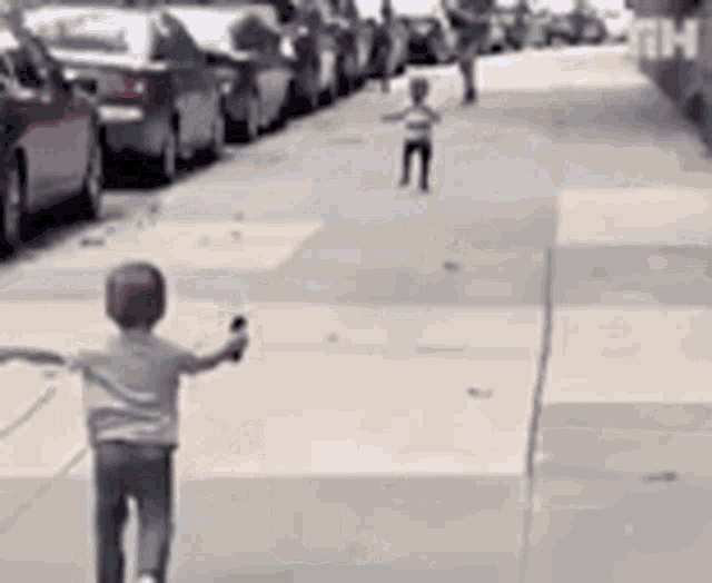 GIF--Famous--White-and-Black-Children-Running-to-Hug-One-Another.gif