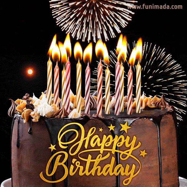 GIF--Brown-Cake-with-Candles--Fireworks-in-Background--HAPPY-BIRTHDAY.gif