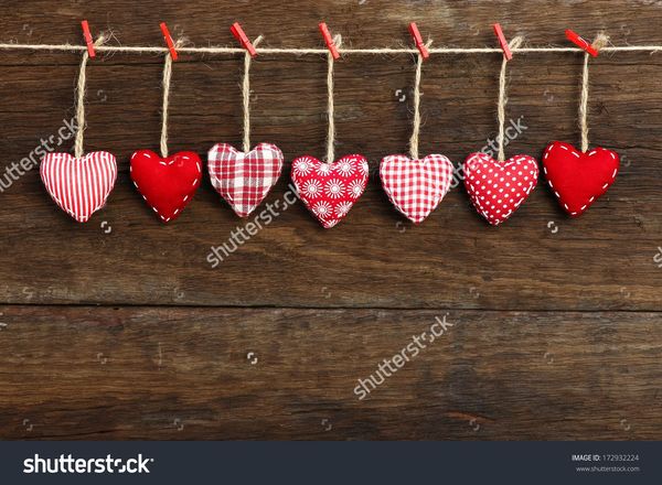 stock-photo-gingham-love-valentine-s-hearts-natural-cord-and-red-clips-hanging-on-rustic-driftwood-texture-172932224.jpg