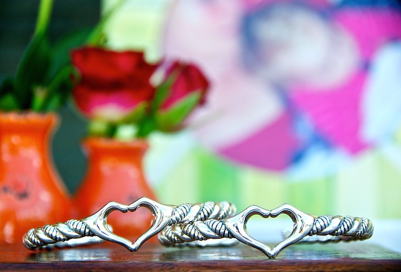 Love collection. 2 Love cuffs in front of picture of mom and Olive 4.6 launch.jpg