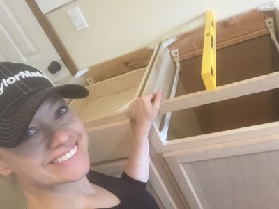 Mary building cabinets.JPG